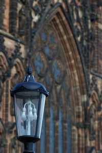 Street light on wall of old building