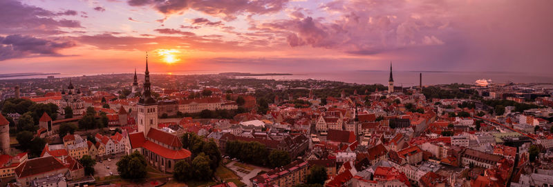 Panoramic view of old tallinn city at purple sunset, estonia.