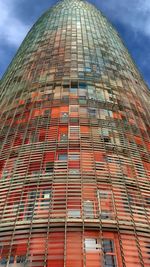 Low angle view of building against cloudy sky