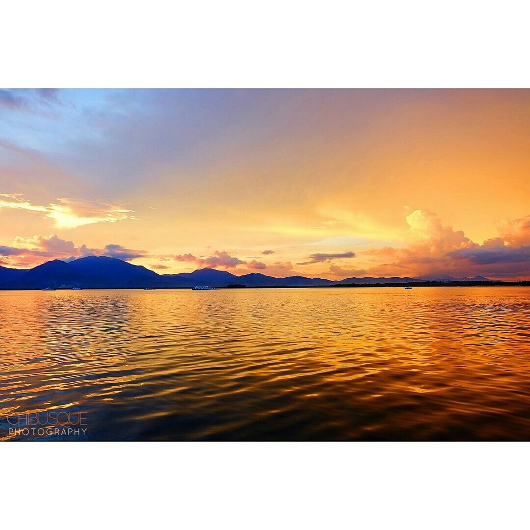 transfer print, sunset, water, scenics, auto post production filter, tranquil scene, beauty in nature, sky, tranquility, sea, orange color, nature, waterfront, idyllic, rippled, cloud - sky, lake, reflection, outdoors, mountain