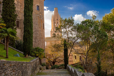 Panoramic view of old building and trees against sky