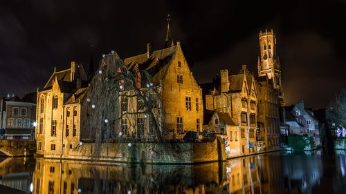 Illuminated buildings in city at night