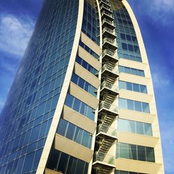 Low angle view of office building against sky