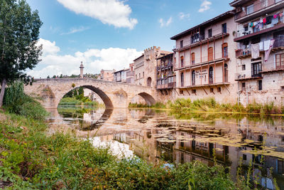 Stone bridge over the river makes the entrance to the old medieval city of valderrobres.