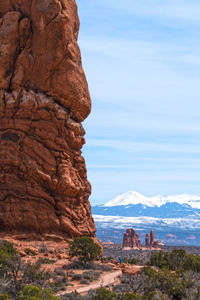 View of rock formation against cloudy sky