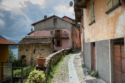 Footpath amidst buildings in town