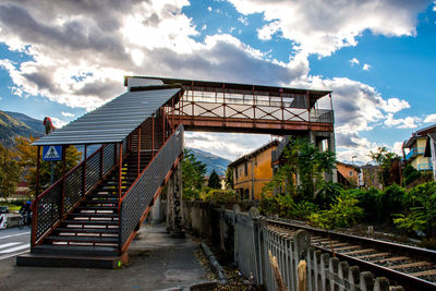 Staircase by building against sky in city