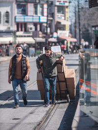 People walking on street in city