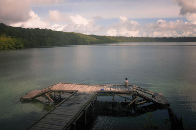 High angle view of pier over lake against sky