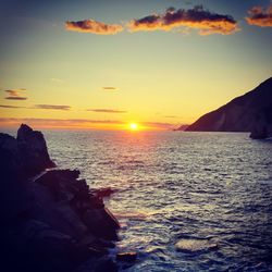 Scenic view of sea against sky during sunset