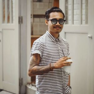 Portrait of young man wearing sunglasses standing outdoors