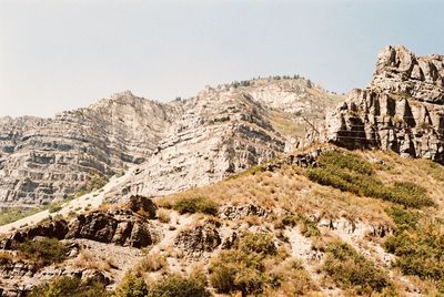 Scenic view of rocky mountains against clear sky