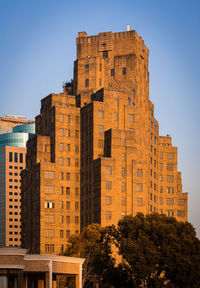 Low angle view of buildings against clear sky