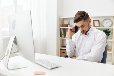 Businesswoman working at desk in office