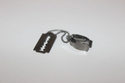 Close-up of ring on white background