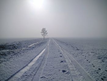 Scenic view of frozen landscape against clear sky