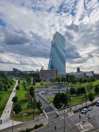 View of city street and buildings against sky