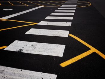 High angle view of arrow sign on road