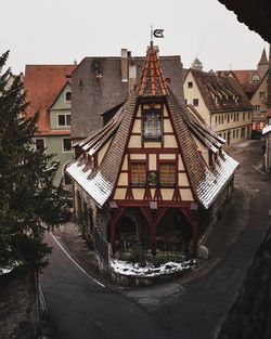 Panoramic view of houses and buildings against sky