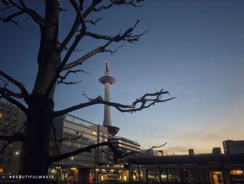 Low angle view of illuminated buildings against sky