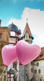 Close-up of pink built structure against sky