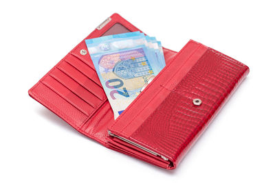 High angle view of paper currency on white background