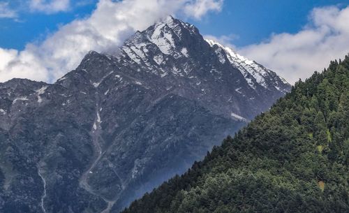 Low angle view of mountain range against sky