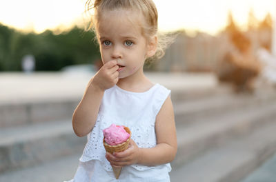 Cute girl holding ice cream