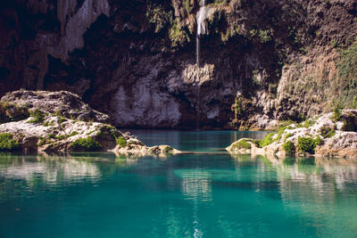 Scenic view of rock formation in water