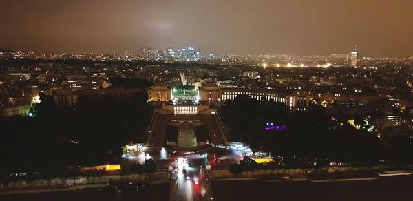 High angle view of illuminated buildings in city at night