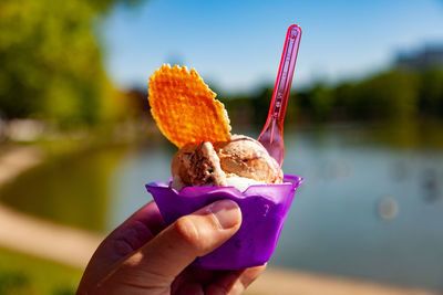 Person holding ice cream