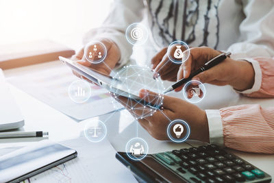 High angle view of person using laptop on table