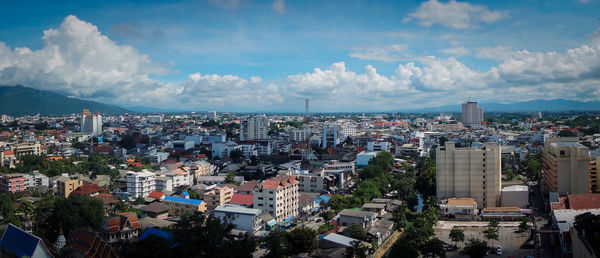 High angle view of city against cloudy sky