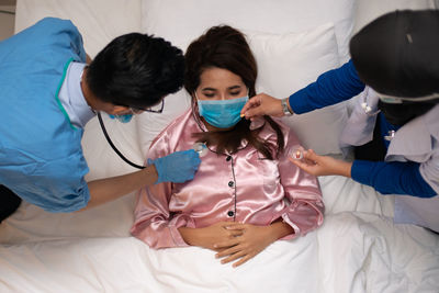 Group of people in the bed