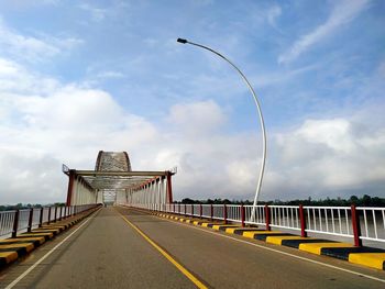 View of bridge against cloudy sky