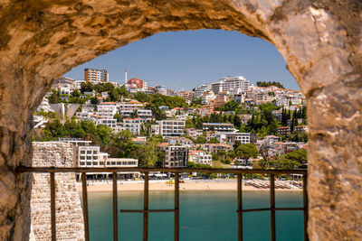 Buildings seen through arch window