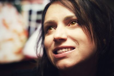 Close-up portrait of a smiling young woman