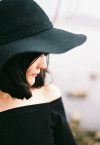 Close-up of mid adult woman wearing hat outdoors