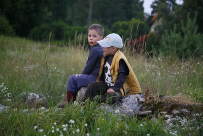 Friends sitting on field