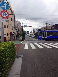 Road in city against sky