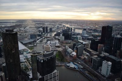 High angle view of cityscape against cloudy sky