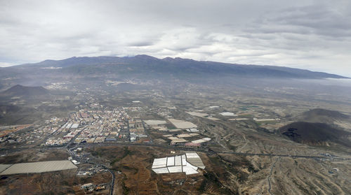 Aerial view of townscape against sky