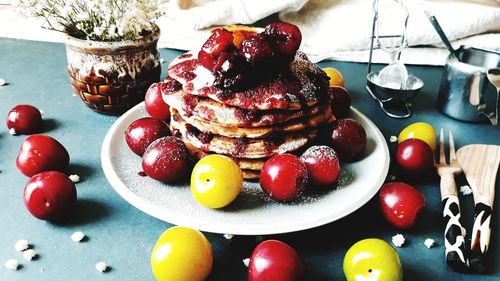 Close-up of fruits in plate on table