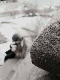 Close-up of woman photographing against sky