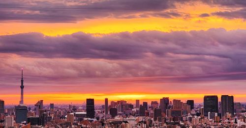 Cityscape against sky during sunset