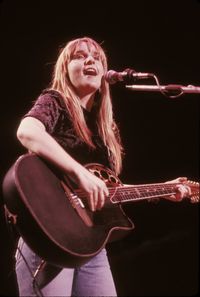 Young woman playing guitar