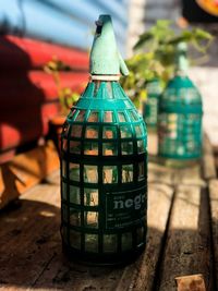 Close-up of glass bottle on table