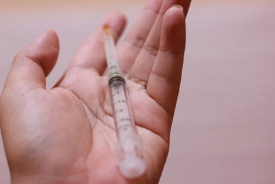 Close-up of person holding hand