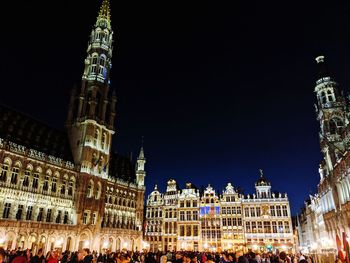 Illuminated buildings in city at night