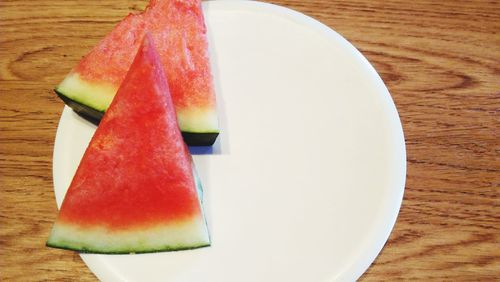 High angle view of fruit in plate on table